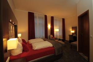 Postel nebo postele na pokoji v ubytování Boutique Hotel Villa Melsheimer