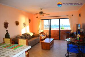 a living room with a couch and a table at Marina Pinacate A-521 in Puerto Peñasco