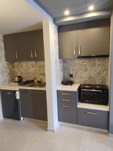 Kuchyň nebo kuchyňský kout v ubytování Stefani apartments