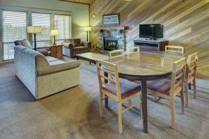 a living room filled with furniture and a tv at Seventh Mountain Resort in Bend