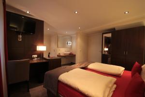 Postel nebo postele na pokoji v ubytování Boutique Hotel Villa Melsheimer