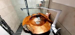 a bathroom with a wooden sink in a bathroom at Nordapartament in Suceava +36 photos