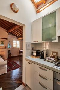 a kitchen with white cabinets and a counter top at CENTRAL- VIEWS - AIR CONDITIONING - Easy Parking -SELF CHECK In in Perugia