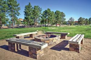 a picnic area with benches and a fire pit at WorldMark Bison Ranch in Overgaard