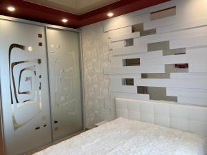 a room with a wall made out of tiles at Omega 6 in Odesa