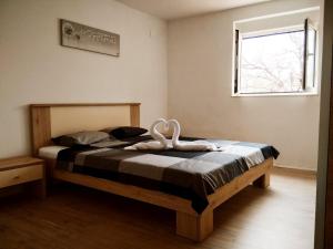Postel nebo postele na pokoji v ubytování Gecko Apartment