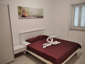 Posteľ alebo postele v izbe v ubytovaní Gecko Apartment