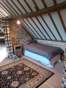 a room with two beds in a attic at The coach house in Llansantffraid-ym-Mechain