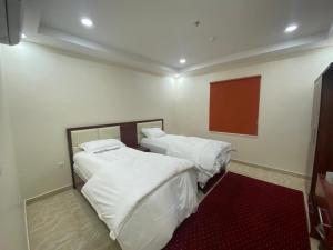 Katil atau katil-katil dalam bilik di لحظة الاحلام للشقق الفندقية