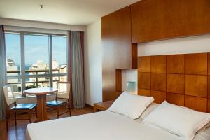 Postel nebo postele na pokoji v ubytování Mar Palace Copacabana Hotel