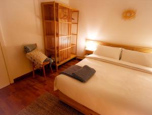 מיטה או מיטות בחדר ב-Vicky's homestay Sanremo - C. CITRA 008055-LT-1257
