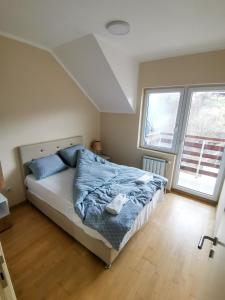 Voodi või voodid majutusasutuse Apartmani Sigma toas