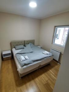 Voodi või voodid majutusasutuse Apartmani Sigma toas