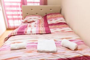 Voodi või voodid majutusasutuse Apartmani Sigma toas