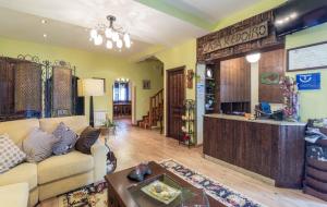 a living room with a couch and a counter at Hotel Casa Reboiro in Monforte de Lemos