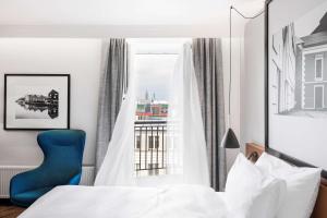 Säng eller sängar i ett rum på MERCURE HOTEL KLAIPEDA CITY, Conference, Restaurant & Bar - Accor Group