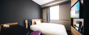 Giường trong phòng chung tại Hakata Nakasu Washington Hotel Plaza