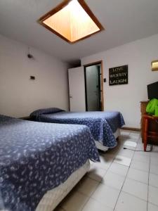 Hostal Caleta Abarca客房内的一张或多张床位