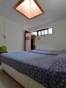 Hostal Caleta Abarca客房内的一张或多张床位