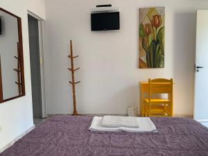 Cama ou camas em um quarto em Villa Paraíso