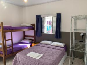 Cama ou camas em um quarto em Villa Paraíso