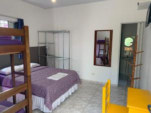Cama ou camas em um quarto em Villa Paraíso