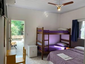 Cama ou camas em um quarto em Villa Paraíso