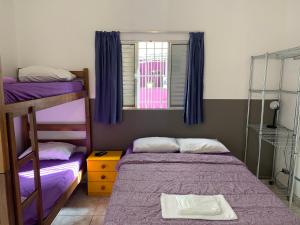 Cama ou camas em um quarto em Villa Paraíso