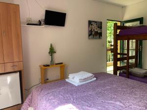 Cama ou camas em um quarto em Villa Paraíso
