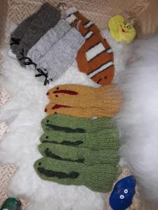 a stuffed toy is laying on a blanket at Hænuvík Cottages in Hnjótur