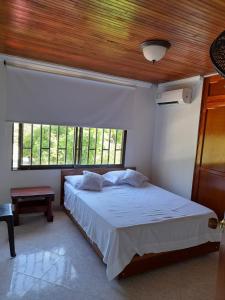 Postel nebo postele na pokoji v ubytování Apartamento Opaa