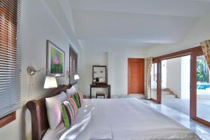 Ένα ή περισσότερα κρεβάτια σε δωμάτιο στο Siam Pool Villa Pattaya +30 φωτογραφίες