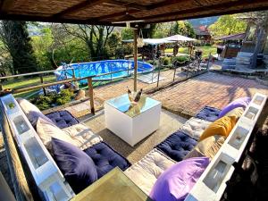 a view of a swimming pool with a bunch of chairs at Brojo Hill in Longare