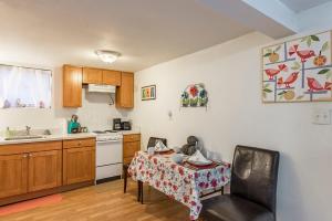 a kitchen with a table with a tablecloth on it at Seattle Urban Village- Unit B- Lago Vista- Lake Union- Sleeps 6 in Seattle