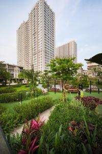 a park with tall buildings in a city at Ecobay Halong -Mountain view and near Marina beach in Ha Long