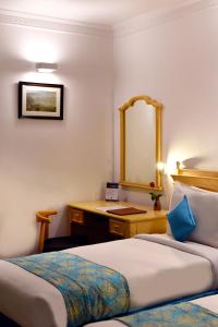 Postel nebo postele na pokoji v ubytování Golden Parkk Hotel