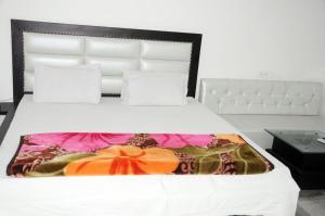 Ένα ή περισσότερα κρεβάτια σε δωμάτιο στο Vamoose Ishaan