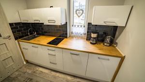 Kuchyňa alebo kuchynka v ubytovaní Apartamenty Silvana