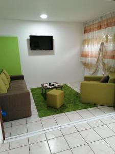 a living room with two couches and a tv at Fast Sleep & Go 1 in Paraćin