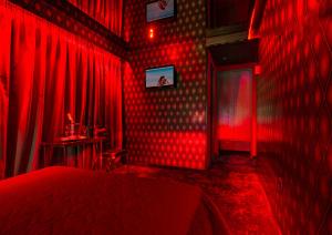 TV a/nebo společenská místnost v ubytování ALFA HOTEL