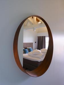 Ein Bett oder Betten in einem Zimmer der Unterkunft THE BAHI VILLA - boutique B&B