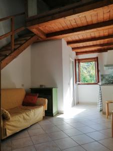 a living room with a couch and a window at I Lecci in Lerici