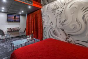TV a/nebo společenská místnost v ubytování ALFA HOTEL