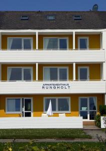 a large white building with a blue sky at Rungholt in Helgoland