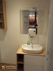 a bathroom with a white sink and a mirror at Biesiada pod lasem in Kielce