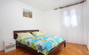 Posteľ alebo postele v izbe v ubytovaní Katja Apartment