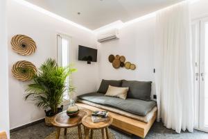 a living room with a couch and a table at Naxian Secret in Naxos Chora