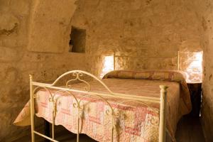 A bed or beds in a room at Il Trullo di Heidi