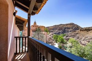 a balcony with a view of the mountains at Hotel 1877 Sensaciones & SPA ADULTS ONLY in Albarracín