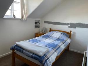 A bed or beds in a room at Belle View cottage